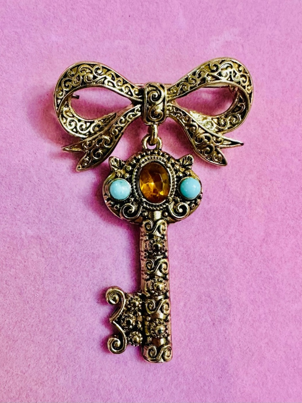 Gold Tone Bow Key Brooch